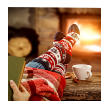Image of person wearing cozy socks near a fire