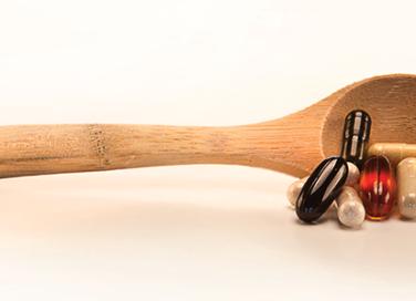 wood spoon and supplements